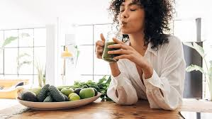 Woman meditating with candles, serene atmosphere